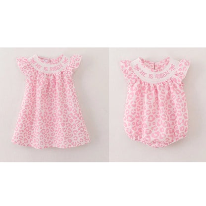 PREORDER 3.2 SISTERS HE IS RISEN EMBROIDERED PINK LEOPARD SMOCKED ROMPER/DRESS